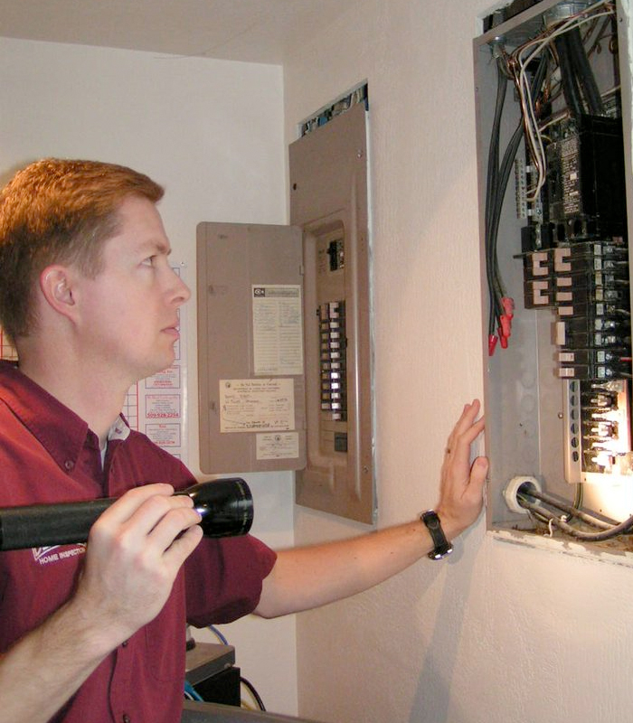 Inspector Checking Out Electric Panel
